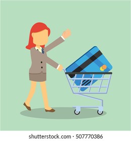 businesswoman with credit card and trolley