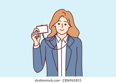 Businesswoman demonstrating ID badge to gain access to room or to introduce herself when meeting colleague. Girl manager in business clothes shows ID badge giving right enter office.