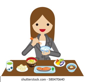 Businesswoman eating Japanese breakfast