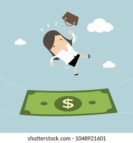 Businesswoman falling into a money banknote. Business concept