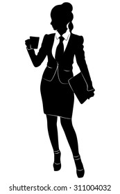 Businesswoman holding a cup of coffee standing in office