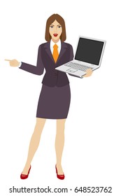 Businesswoman holding a laptop notebook and pointing something beside of her. Full length portrait of businesswoman character in a flat style. Vector illustration.