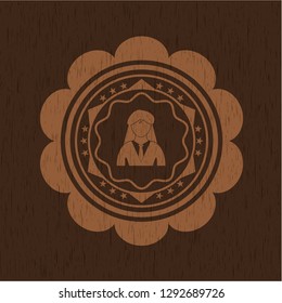 businesswoman icon inside badge with wood background