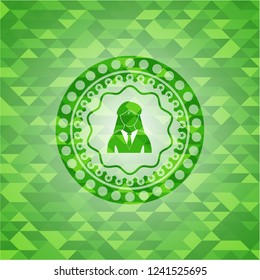 businesswoman icon inside green emblem with triangle mosaic background