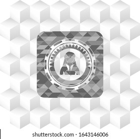 businesswoman icon inside grey icon or emblem with geometric cube white background