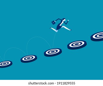 Businesswoman jump to the target respectively and achievement the goal