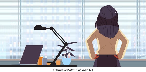 businesswoman looking forward through glass window successful business woman working in office leadership