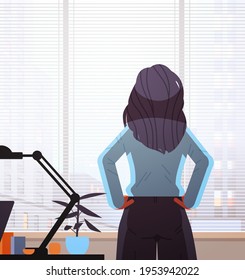 businesswoman looking forward through glass window successful business woman working in office leadership
