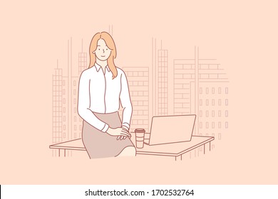 Businesswoman or manager in office concept. Young business woman, company chief, leader boss sitting on office work table with coffee and laptop. Office clerk or manager looking at camera.