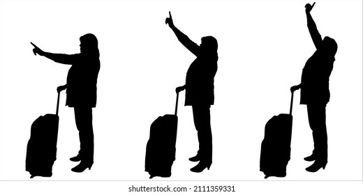 A businesswoman in a pantsuit waving with one hand while holding the handle of luggage on wheels with the other hand. The passenger points with his hand to an object above, below, in front of him. 