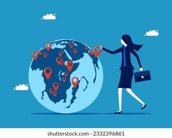 Businesswoman pinning branches on global map