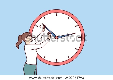 Businesswoman practices time management and moves hands of giant clock to become more productive. Time management technologies for career growth and meeting deadlines set by company manager