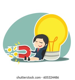 businesswoman relaxing beside big bulb and pulling coin by magnet