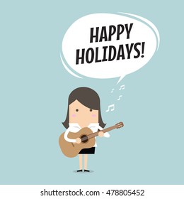 Businesswoman relaxing by playing guitar and sing a song.
