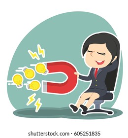 businesswoman relaxing using magnet to attract ideas