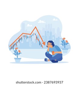 A businesswoman with a sad face is sitting on the floor holding a cell phone. Stressed looking at cell phones because of the declining stock exchange market graph. Stock Trading concept. 