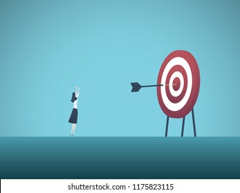 Businesswoman scoring bullseye with dart vector concept. Symbol of success, victory, achievement of goals and objectives, skill. Eps10 vector illustration.