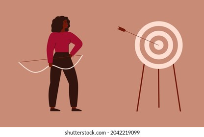 Businesswoman shooting a bow and hit a target. Archery to the bull’s-eye of the dartboard. A strong girl achieves her goals in her life and career. Concept of accuracy business strategy and victory. 