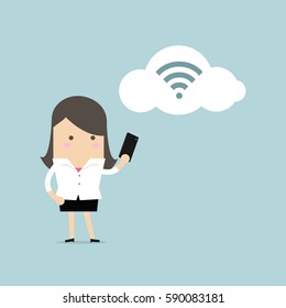 Businesswoman with smartphone and wifi on cloud