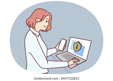 Businesswoman takes care of cyber security standing next to laptop with privacy inscription symbolizing data protection. Girl system administrator uses antivirus or firewall for cyber security