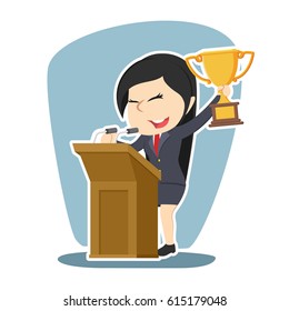 businesswoman with trophy giving speech