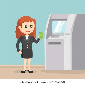 businesswoman using atm machine
