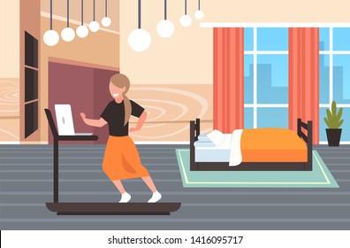 businesswoman using laptop running on treadmill woman freelancer workout hard working concept modern bedroom interior flat full length horizontal