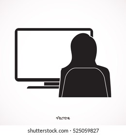 Businesswoman working on a large screen desktop computer while sitting at her desk at the office, view from behind sowing the blank monitor