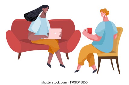 Businesswomen dressed in formal clothes are sitting on the sofa together, talking, drinking coffee. Office workers discussing matters. Friendly colleagues or friends communicating during the break