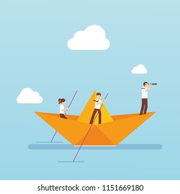 Bussiness team with paper boat in the ocean
