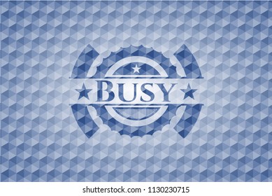 Busy blue emblem with geometric background.