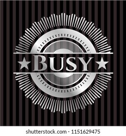 Busy silver emblem or badge