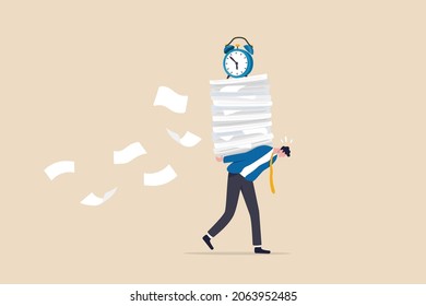 Busy workload and deadline causing exhaustion and burnout, overload or overworked office routine concept, tired businessman carrying heavy documents paperwork with alarm clock deadline on top.