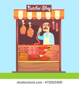 Butcher Behind Market Counter With Assortment Of Meat