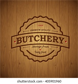 Butchery Vintage Logo. Embossed Logo On Vintage Wooden Background. 