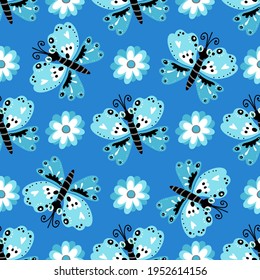 Butterflies and flowers are blue on a blue background.Pattern for textile, fabric, packaging paper, background, wallpaper, material.