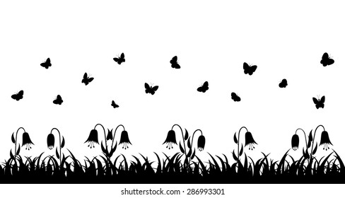 Butterflies fly over the grass and flowers. Seamless vector illustration.