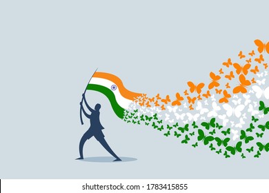 Butterflies flying from the Indian tricolour flag hoisted by a person. An Indian Independence Day concept