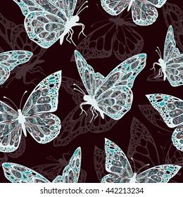 Butterflies with multicolored oriental ornament in style boho, hippie, seamless pattern, ethnic design, arabesque, bohemian. Embroidered openwork exotic Insect. Textiles, fabric design, wallpaper