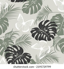 
Butterflies, palm leaves and monstera leaves. Vector seamless pattern. Exotic plants design.
