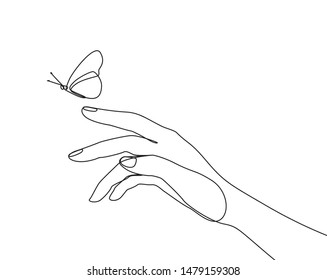 Butterfly flies by hand