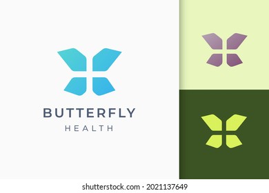 Butterfly or health plus abstract logo in simple and modern shape