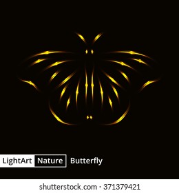 Butterfly silhouette of gold lights on black background