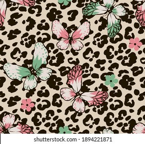 Butterflys and flowers on leopard dots seamless pattern. Vector ilustration.