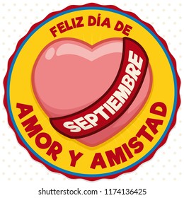 Button with Colombia flag colors and a heart with ribbon to celebrate in September the Colombian version of Valentine's Day: "Dia del Amor y la Amistad" (written in Spanish).