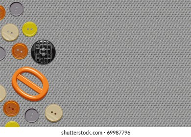 Buttons on a seamless duck canvas texture forming some copy space on the right