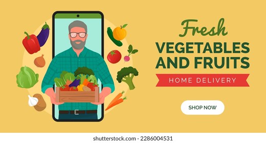 Buy farm fresh vegetables and fruits online: farmer in a smartphone screen holding a crate with fresh vegetables and fruits
