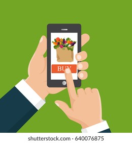 Buy food online. Flat vector illustration. Hand ordering fresh food hold smartphone with food basket on the screen. 
