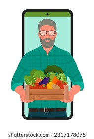 Buy vegetables directly from local farmers: man holding a crate full of organic vegetables in a smartphone screen