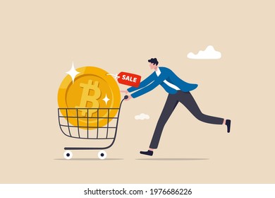 Buying Bitcoin on sale when cryptocurrency price crash to make profit concept, smart man buying or purchasing crypto currency Bitcoin in shopping cart trolley to speculate earning in the future.